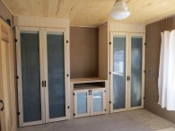 Bedroom closets are solid wood with milk paint finish and glass in doors.