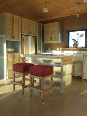 The kitchen cabinets are aluminum frames with tempered glass panels and tempered glass shelves.