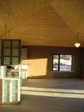 The main room with the kitchen, dining room and livingroom. The ceiling follows the roofline. Tongue and groove aspen ceiling was sealed with 3 coats of AFM Safeseal.