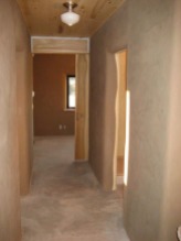 Natural plaster walls are earth, sand, and water mixed on site.